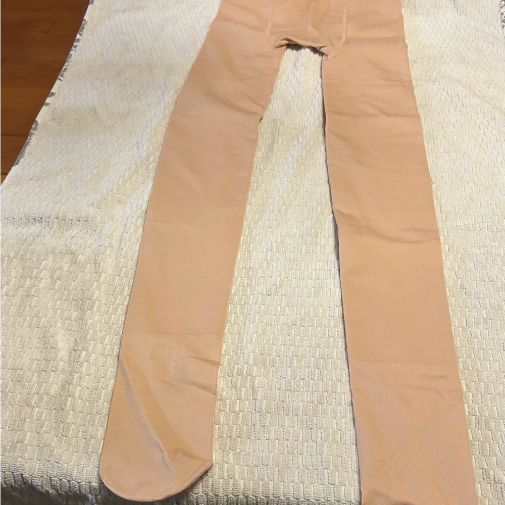 Source‎ Unknown Tan tights